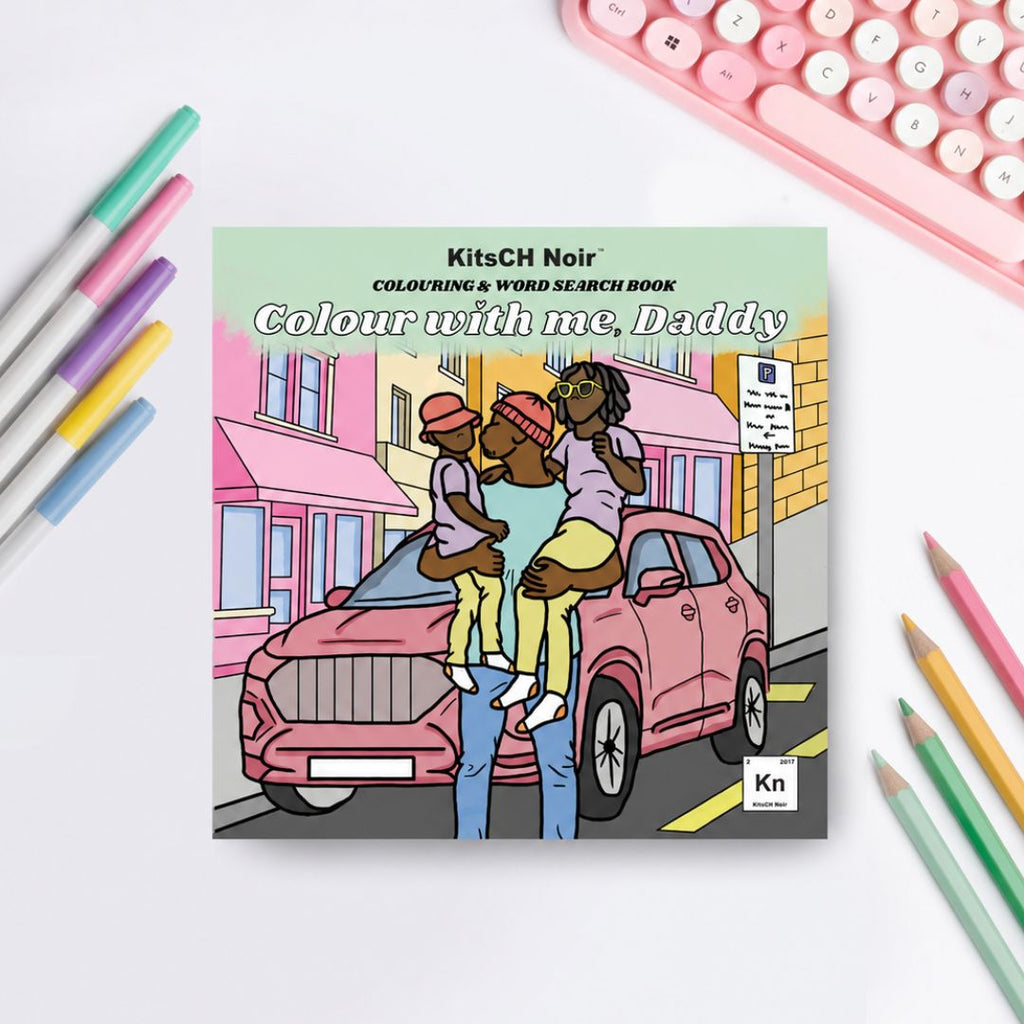 Coloring book titled 'Colour with me, Daddy' by KitsCH Noir on a white surface with colored pencils.