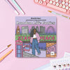 Coloring book titled 'London Life Cuties' by KitsCH Noir on a pink surface with stationery items.