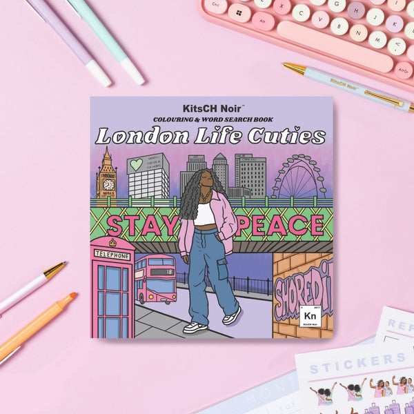 Coloring book titled 'London Life Cuties' by KitsCH Noir on a pink surface with stationery items.